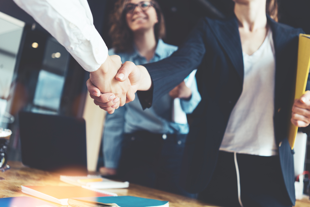 shaking hands shutterstock_653993329